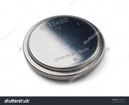 stock-photo-lithium-button-cell-battery-isolated-on-white-78218134.jpg