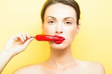 65380724-young-cute-woman-or-girl-portrait-with-red-chilli-pepper-in-sexy-lips-on-pretty-face-an.jpg