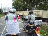 Map holders using pegs at train crossing.jpg