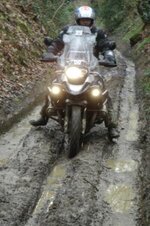 riding down the muddy small.JPG