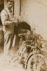 1931 AJ Gregory repairing motorbike for trip to Cape Town.jpg