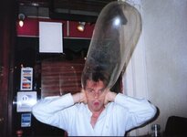 condom-being-inflated-over-mans-head-anon.jpg